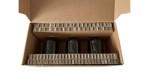 Verpackung für Glasfläschchen aus Wabenpappe im Umkarton