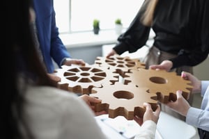efficient-business-team-connects-wooden-gears-into-one-nextpack